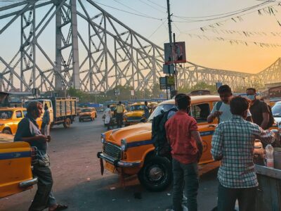 People meet for chai and conversation at sunset under the Hooghly Bridge.