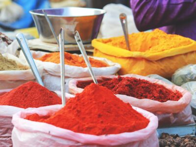 Mounds of colored powder. Credit Akhil Chandran, Unsplash.