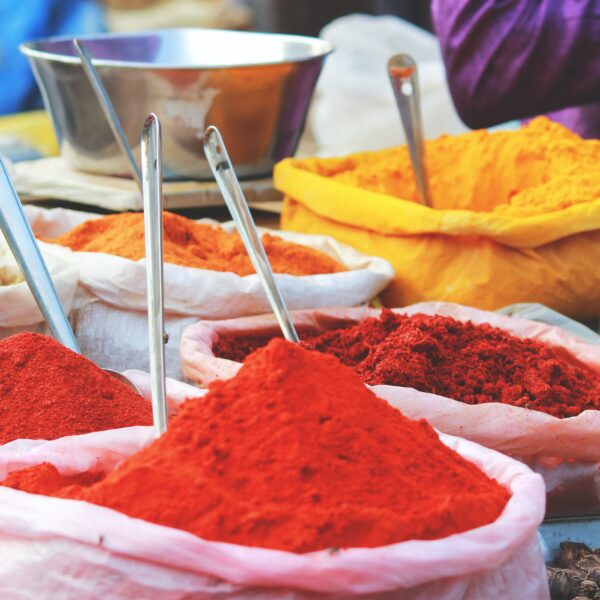 Mounds of colored powder. Credit Akhil Chandran, Unsplash.